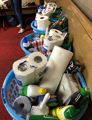 Laundry baskets of household supplies donated to local women's shelter.