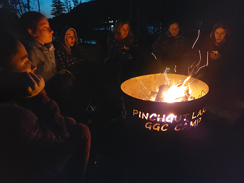 Girls around the campfire