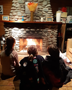 Sitting around fireplace