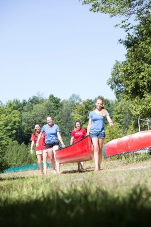 People carrying a canoe