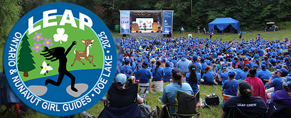 LEAP crest with the words LEAP Ontario & Nunavut Girl Guides Doe Lake 2025 overlayed on a picture of he backs of LEAP 2019 attendees all in blue sitting on a hill at Doe Lake camp watching the LEAP stage presentation.