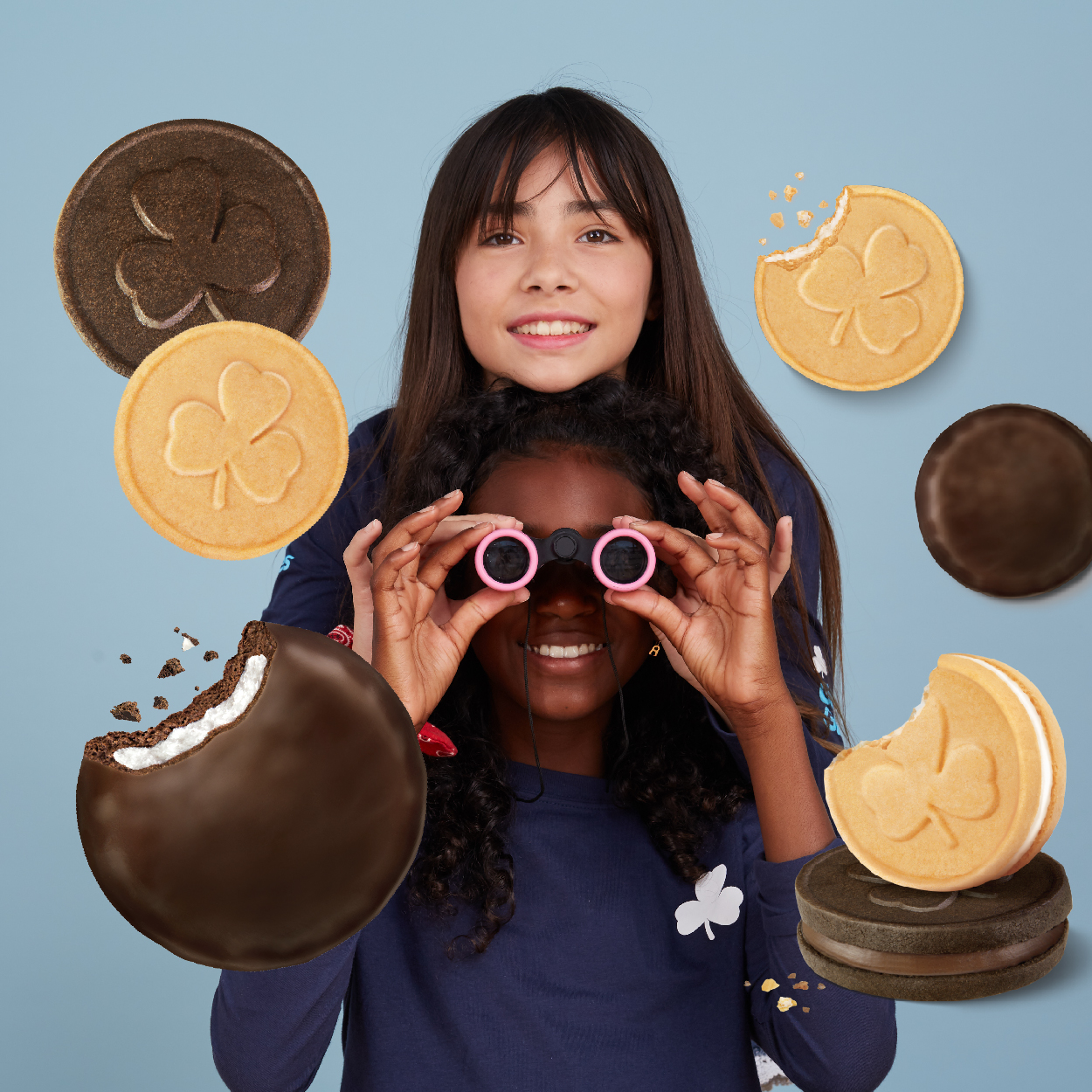 girls with binoculars and cookies picture in background